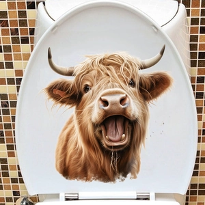Détail d'un autocollant de vache des Highlands étanche sur un abattant de WC blanc