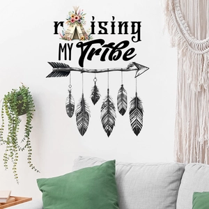 Detail of Raising MY Tribe wall decal with feathers and tent on white living room wall