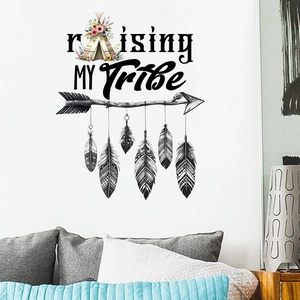 Detail of Bohemian wall sticker featuring feather arrow design on a white bedroom wall