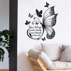 Wall decal with butterfly motifs and ‘Your Wings were ready’ text in a living room