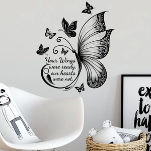 Detail of waterproof butterfly wall decals with sentimental quote on a modern grey wall