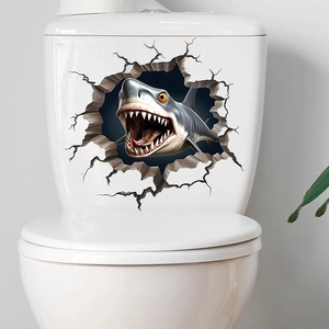 3D shark breaking through wall sticker applied on white toilet tank surface