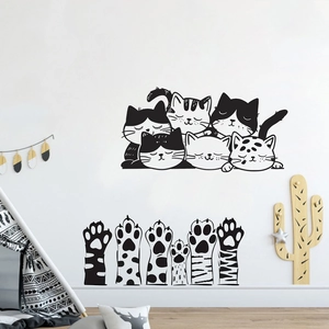 Detail of cute cat face and paw stickers as creative home wall decoration in a nursery