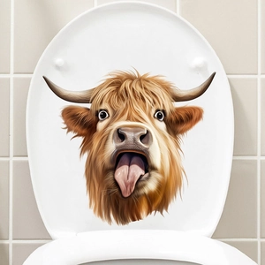 Détail d'un autocollant drôle de vache Highland écossaise sur un abattant de toilettes