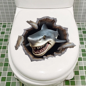 Detail view of a 3D shark wall sticker with a broken wall effect on a toilet lid