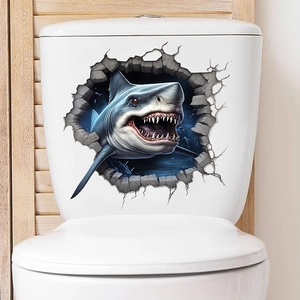 Detailed view of creative 3D shark wall sticker breaking through a white bathroom wall
