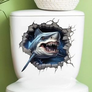 Detailed close-up of 3D shark wall sticker applied on a white bathroom toilet tank