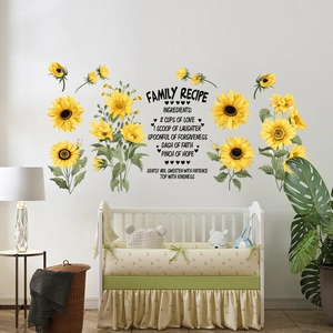 Detail of sunflower wall stickers with inspirational family recipe quotes on home wall