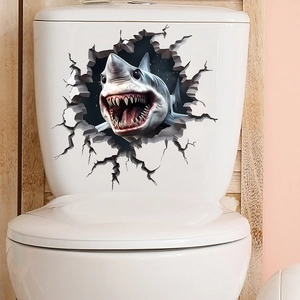 Detail of 3D cracked wall shark sticker applied on white toilet tank with realistic design
