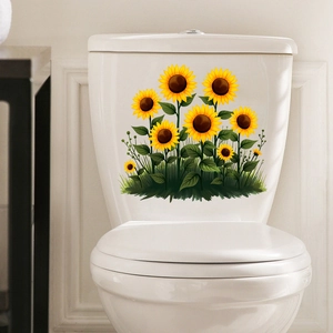 Détails d'autocollants tournesols jaunes éclatants sur un réservoir de toilettes étanche