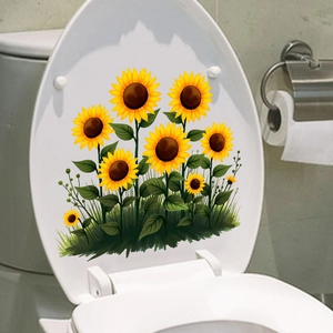 Détail de stickers muraux tournesols jaunes imperméables sur un abattant de WC blanc