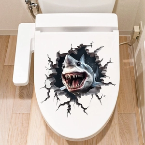 Detail of 3D cracked wall shark sticker applied on a white toilet lid cover