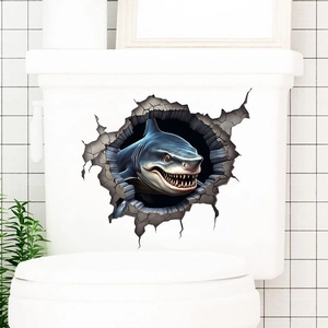 Close-up of a 3D shark wall sticker breaking through a wall on a toilet tank