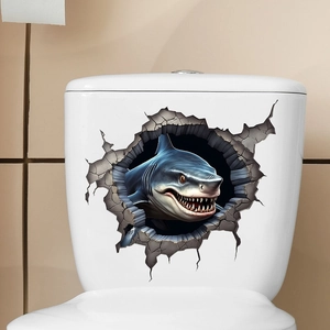 Detail view of 3D cracked wall shark sticker applied on a white ceramic toilet tank