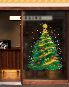 Detail of green Christmas tree window sticker with gold stars and red ornaments on glass