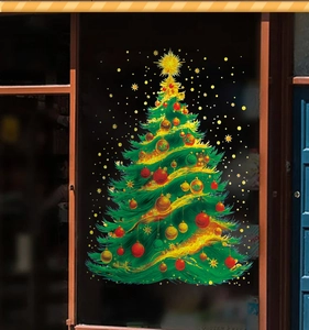 Detailed close-up of a static Christmas tree window cling with golden stars and red baubles