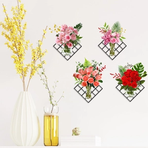 Close-up of wall-mounted diamond mesh planters with hanging glass flower vases and greenery