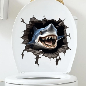 Detailed view of 3D shark wall sticker with broken wall effect applied to a toilet lid