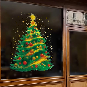 Golden Christmas tree glass window decal with red ornaments and bright star on dark background
