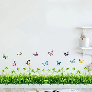 Sticker mural adhésif avec herbe verte et papillons colorés pour décoration intérieure