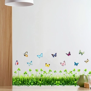 Détails des stickers muraux herbe verte et décalcomanies de papillons colorés sur mur blanc