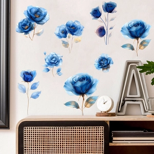 Detail of blue rose wall decals with gold outlines and silk texture on white wall