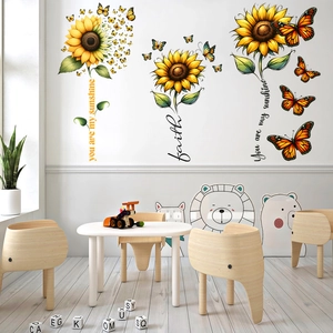 Sunflower and butterfly wall decals with positive phrases in a cozy children playroom