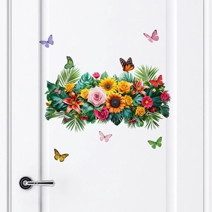 Self-adhesive wall stickers with sunflowers, roses and butterflies on a white door
