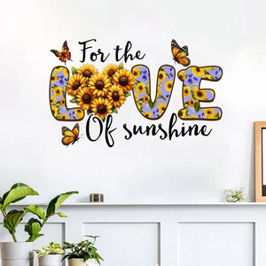 Detail of sunflower pattern inside LOVE text wall sticker with orange butterfly accents