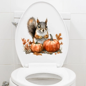 Hand-painted squirrel and pumpkin waterproof sticker on a white bathroom toilet lid