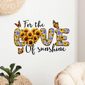 Detail of LOVE sunshine wall sticker with realistic sunflowers and purple flowers on wall