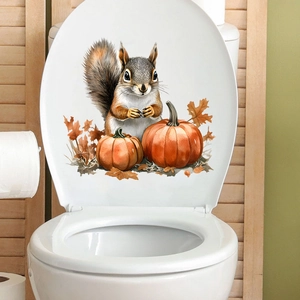Waterproof squirrel and pumpkin autumn themed sticker on a white toilet lid surface