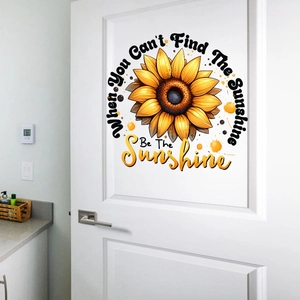 Detail of sunflower wall sticker with Be The Sunshine inspirational text on a white door