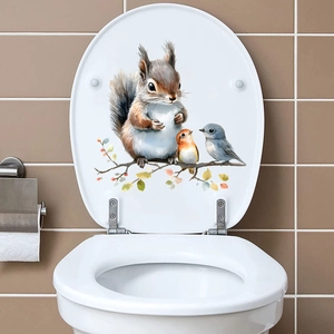 Waterproof squirrel and birds wall decal applied to a white ceramic toilet lid