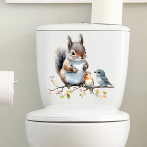 Watercolour squirrel and birds decal applied on a white bathroom toilet tank surface