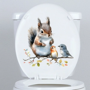 Detail of waterproof squirrel and bird wall sticker on a white toilet lid surface