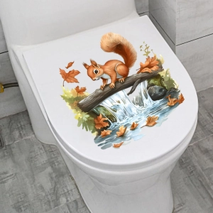 Detail of waterproof squirrel wall sticker with autumn maple leaves on a white toilet lid