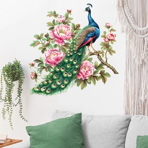 Detailed peacock and pink peony wall sticker displayed on a white wall above a gray sofa