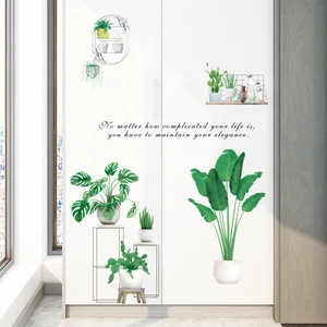 Detail of 3D green potted plant wall stickers with motivational quote on white cabinet