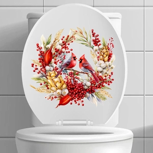 Detail of Christmas cardinal birds and berry wreath sticker on a white toilet lid