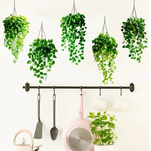 Five-piece artificial hanging plant set with green leaves and black metal chains for wall decor