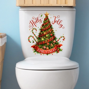 Dettaglio dell'adesivo murale albero di Natale Holly Jolly su un serbatoio del WC bianco
