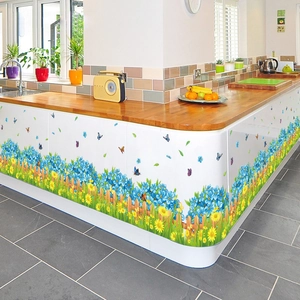 Floral garden wall decals with yellow daisies and blue flowers on a picket fence