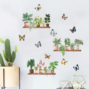 Detail of waterproof wall stickers showing potted plants and butterflies on a grey wall