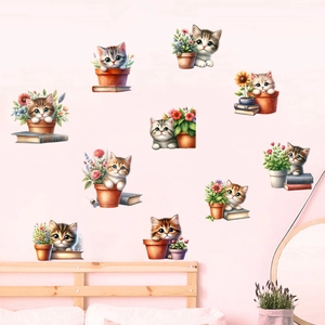 Detail of 3D cat and flower wall stickers on a pink bedroom wall with sunflower accents