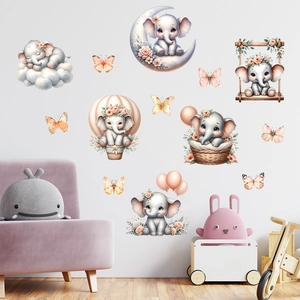 Detail of pink elephant wall stickers with balloons and moon in a nursery setting