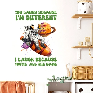 Cartoon astronaut and rocket wall decal with planet motifs and creative quotes for home decor