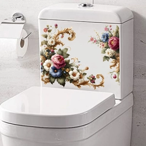 Close-up of pink roses and gold baroque floral stickers on a white ceramic toilet tank
