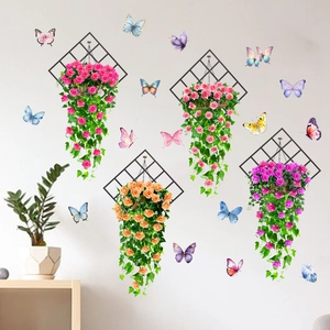 Detail of floral wall stickers with colorful 3D butterflies and green vine decorations