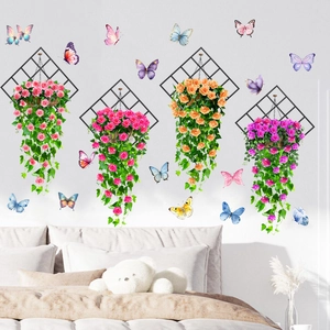 Detail of hanging butterfly floral wall decals with green vines and rose flower balls